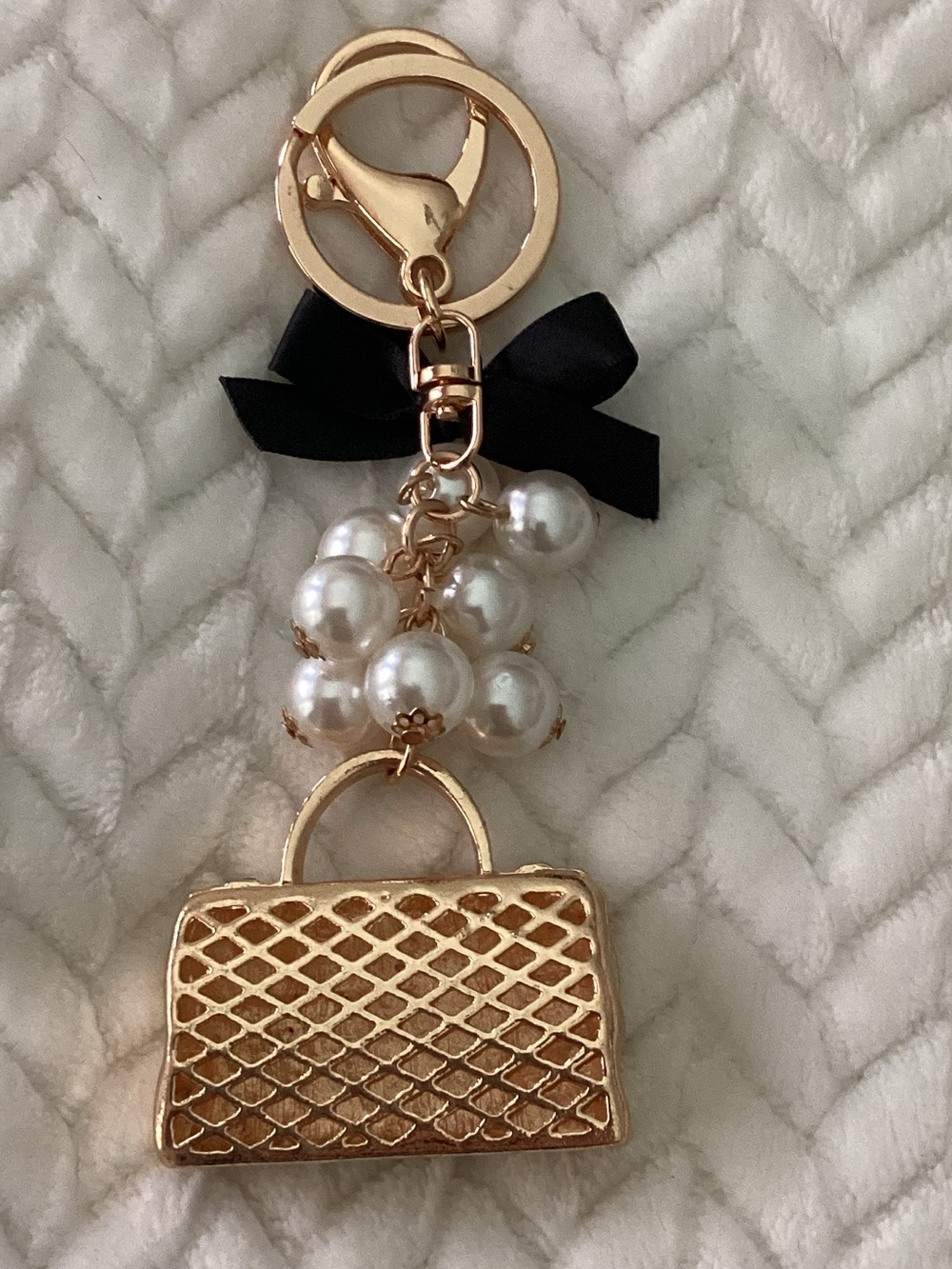 Crystal-Embellished Gold Handbag Keychain with Pearls and Black Bow - Picture 2 of 2